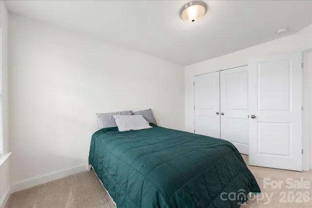 a bathroom with a sink a toilet and shower curtain