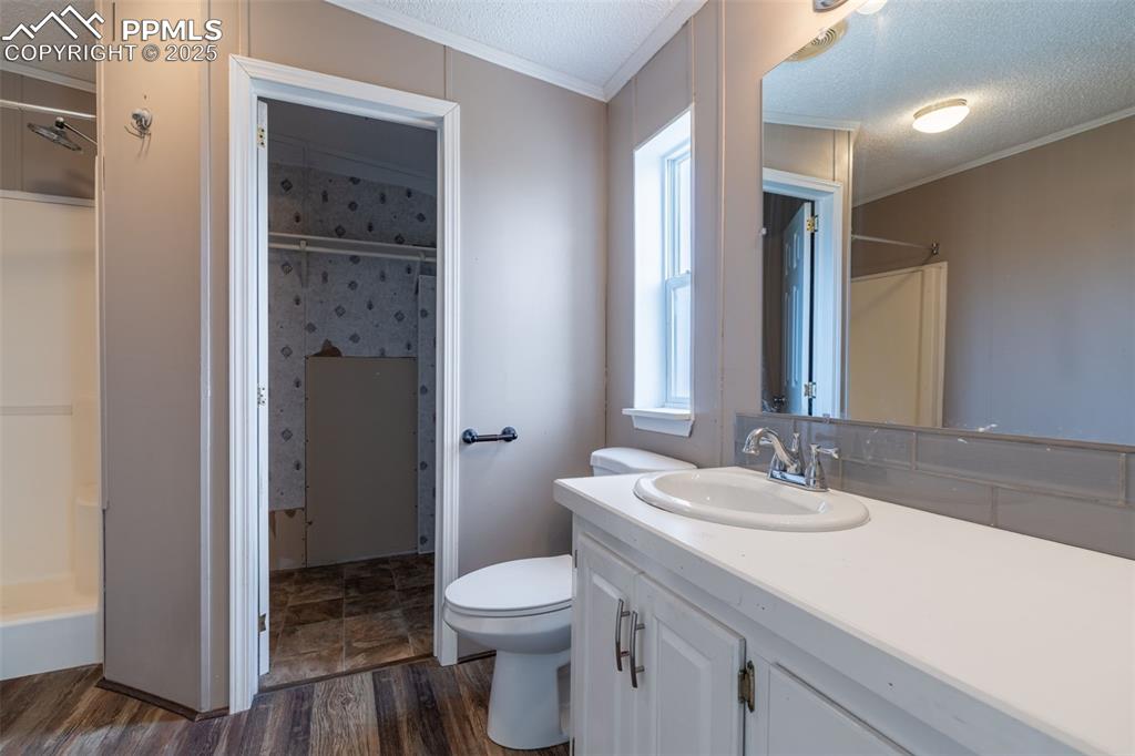 254 Indian Hills Road Florence, CO 81226 - Photo 11 of 22 a bathroom with a sink a toilet and shower