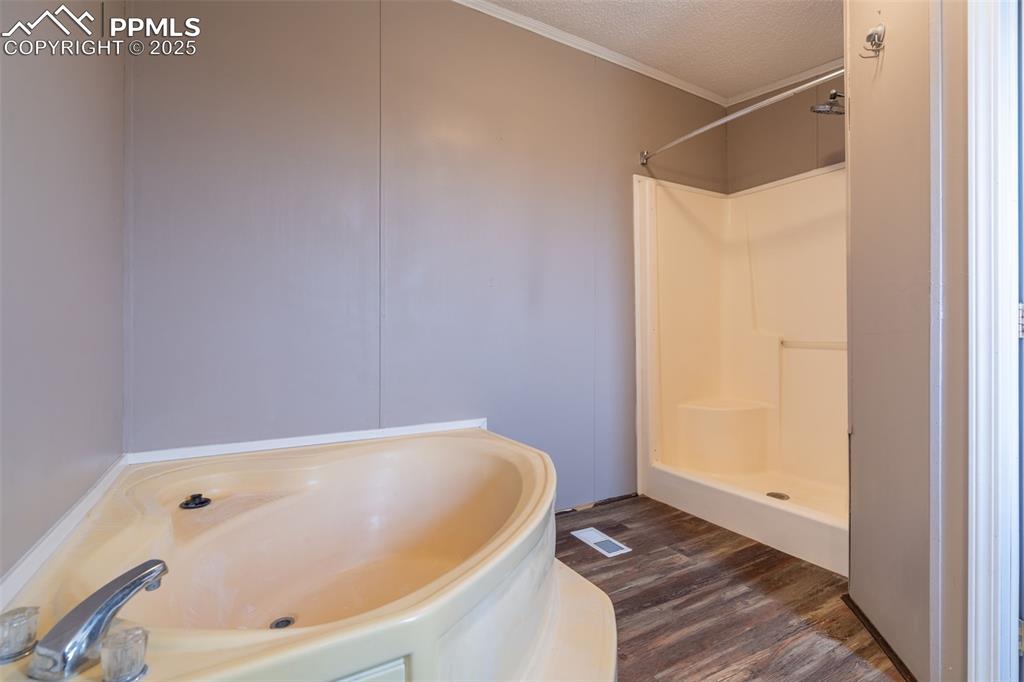 254 Indian Hills Road Florence, CO 81226 - Photo 12 of 22 a bathroom with a tub and shower