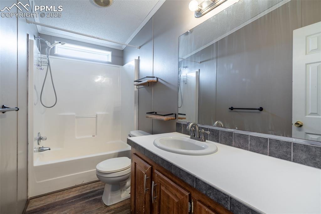 254 Indian Hills Road Florence, CO 81226 - Photo 17 of 22 a bathroom with a sink a toilet and shower