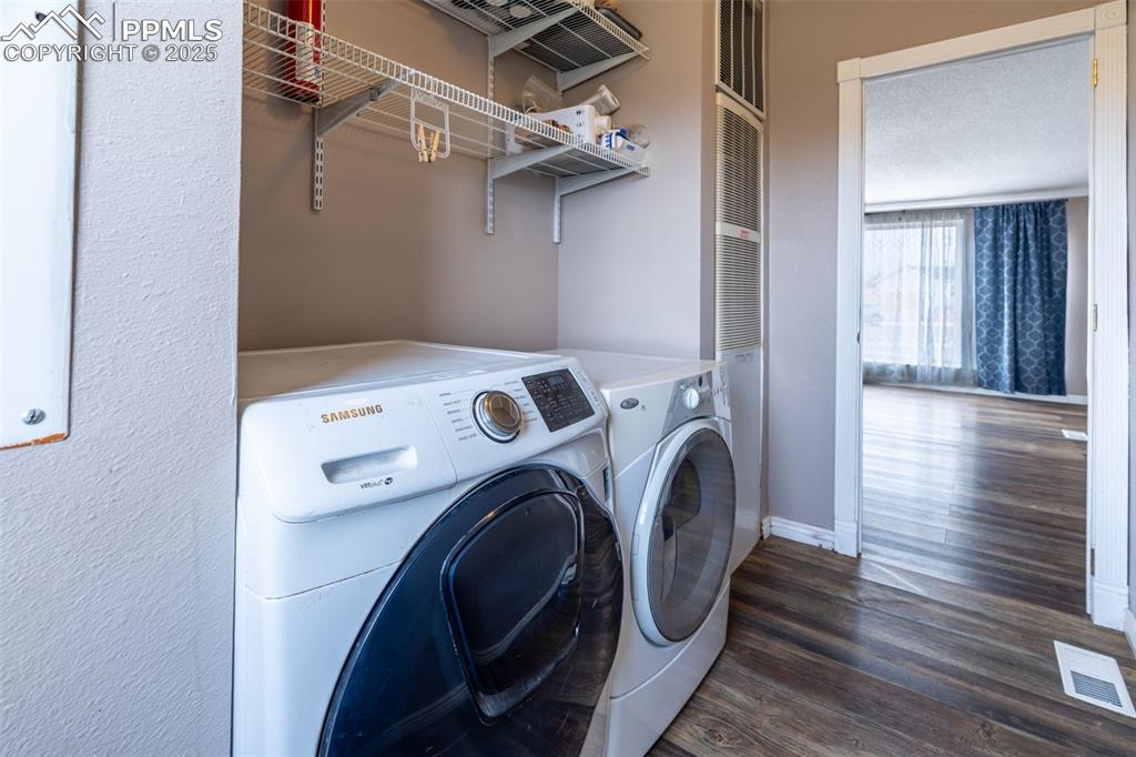 254 Indian Hills Road Florence, CO 81226 - Photo 18 of 22 a view of storage and utility room with washer and dryer