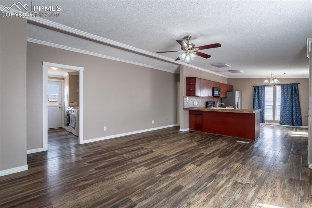 254 Indian Hills Road Florence, CO 81226 - Photo 7 of 22 a view of kitchen with wooden floor and window