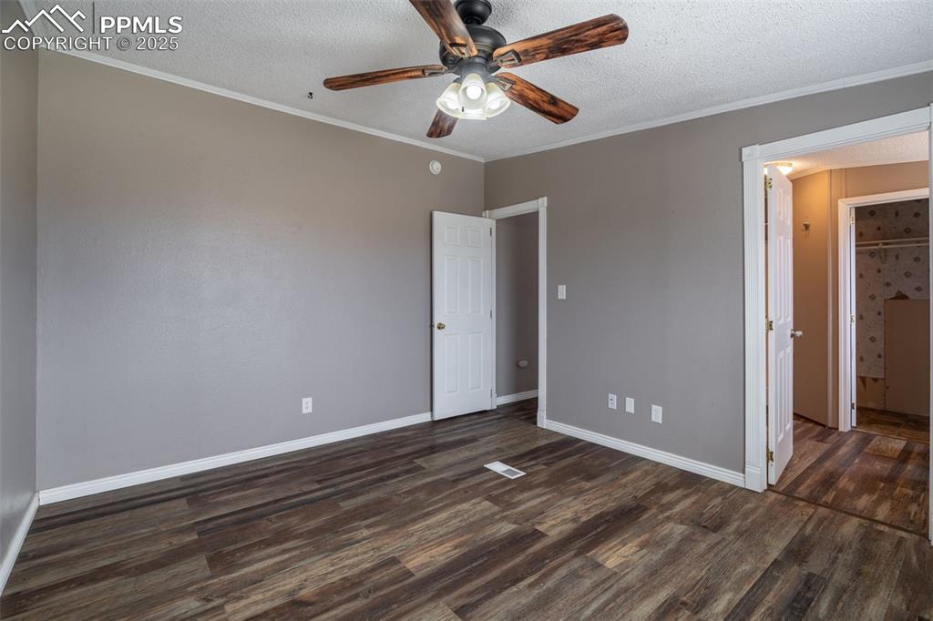 254 Indian Hills Road Florence, CO 81226 - Photo 9 of 22 wooden floor in an empty room