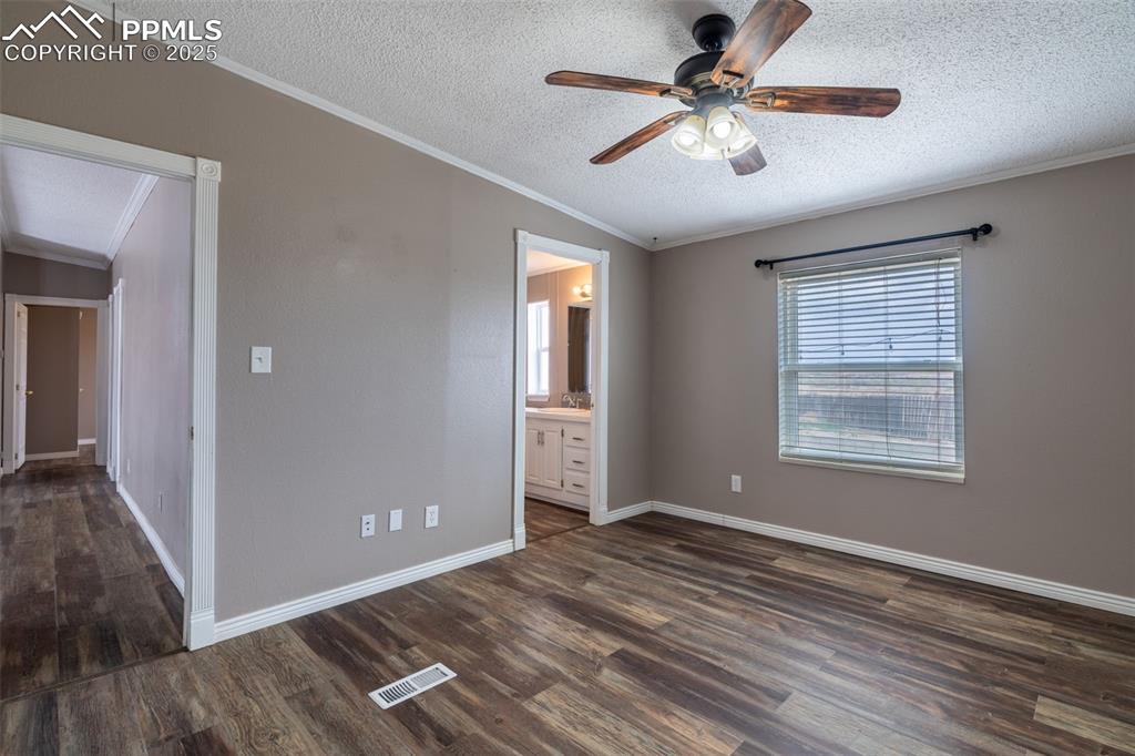 254 Indian Hills Road Florence, CO 81226 - Photo 10 of 22 a view of a livingroom with a ceiling fan and window