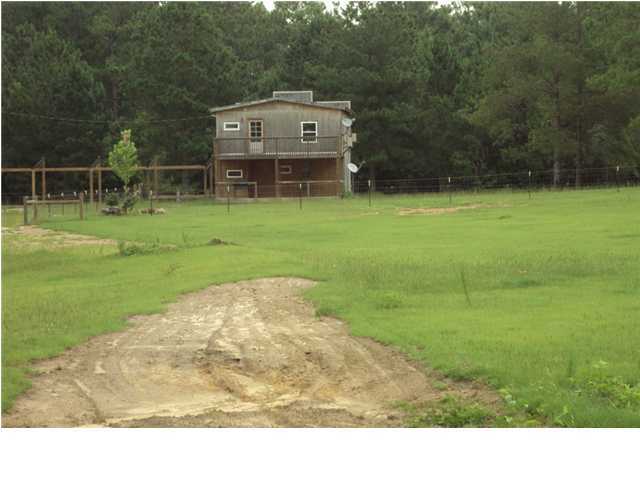 8365 Mountain City Road Baker, FL 32531 - Photo 22 of 22 a view of a house with a yard