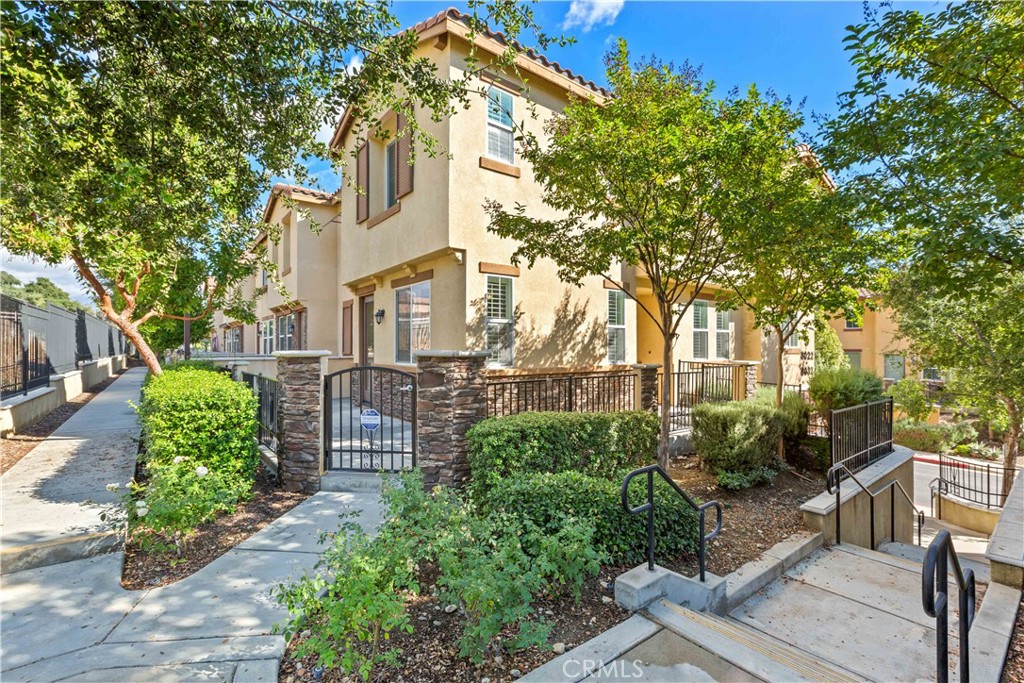 8032 Cresta Bella Road Rancho Cucamonga, CA 91730 - Photo 1 of 1 a front view of a house with garden