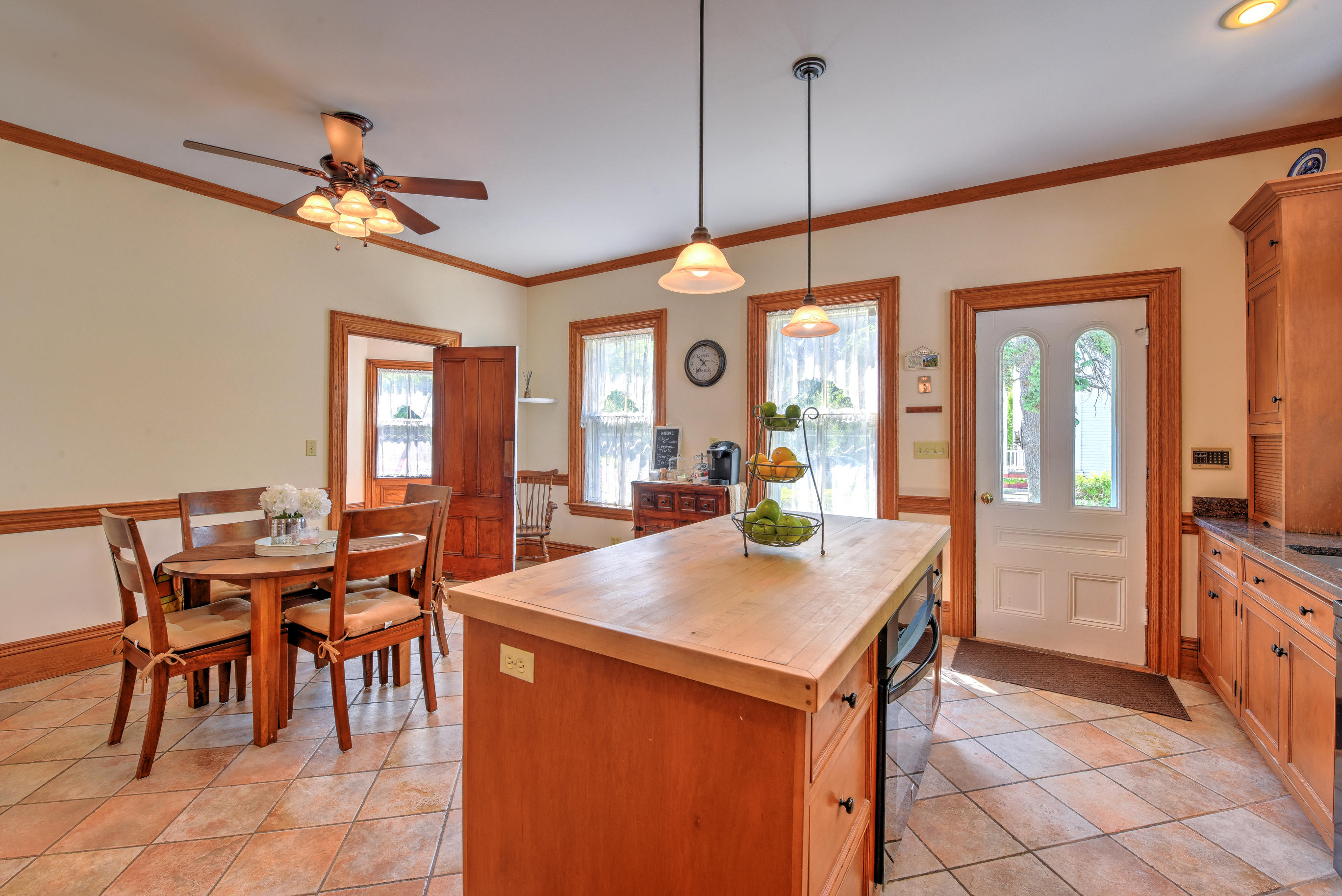 508 Main Street Centerville, MA 02632 - Photo 15 of 35 a view of a dining room with furniture and a chandelier