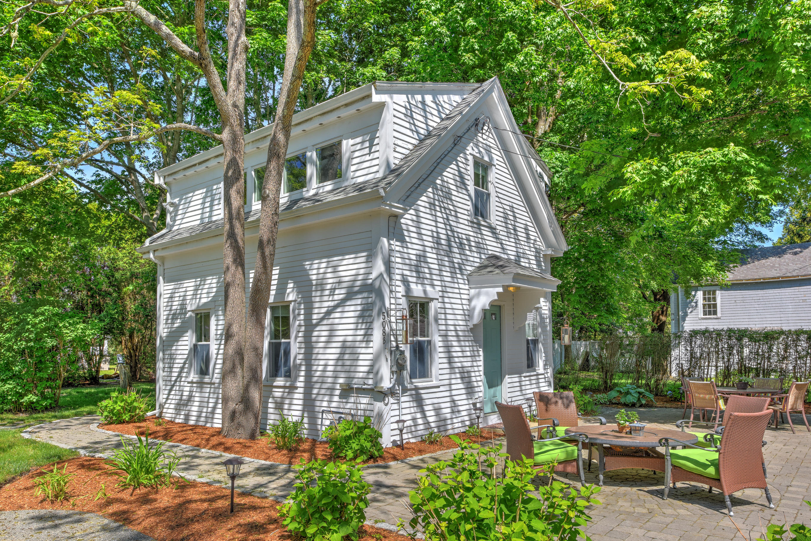 508 Main Street Centerville, MA 02632 - Photo 25 of 35 a view of a house with backyard and sitting area