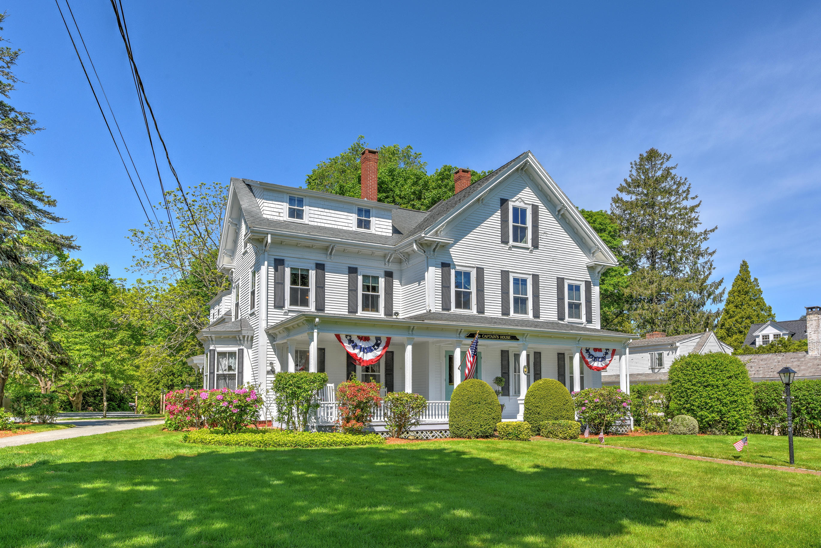 508 Main Street Centerville, MA 02632 - Photo 3 of 35 a front view of house with yard and green space