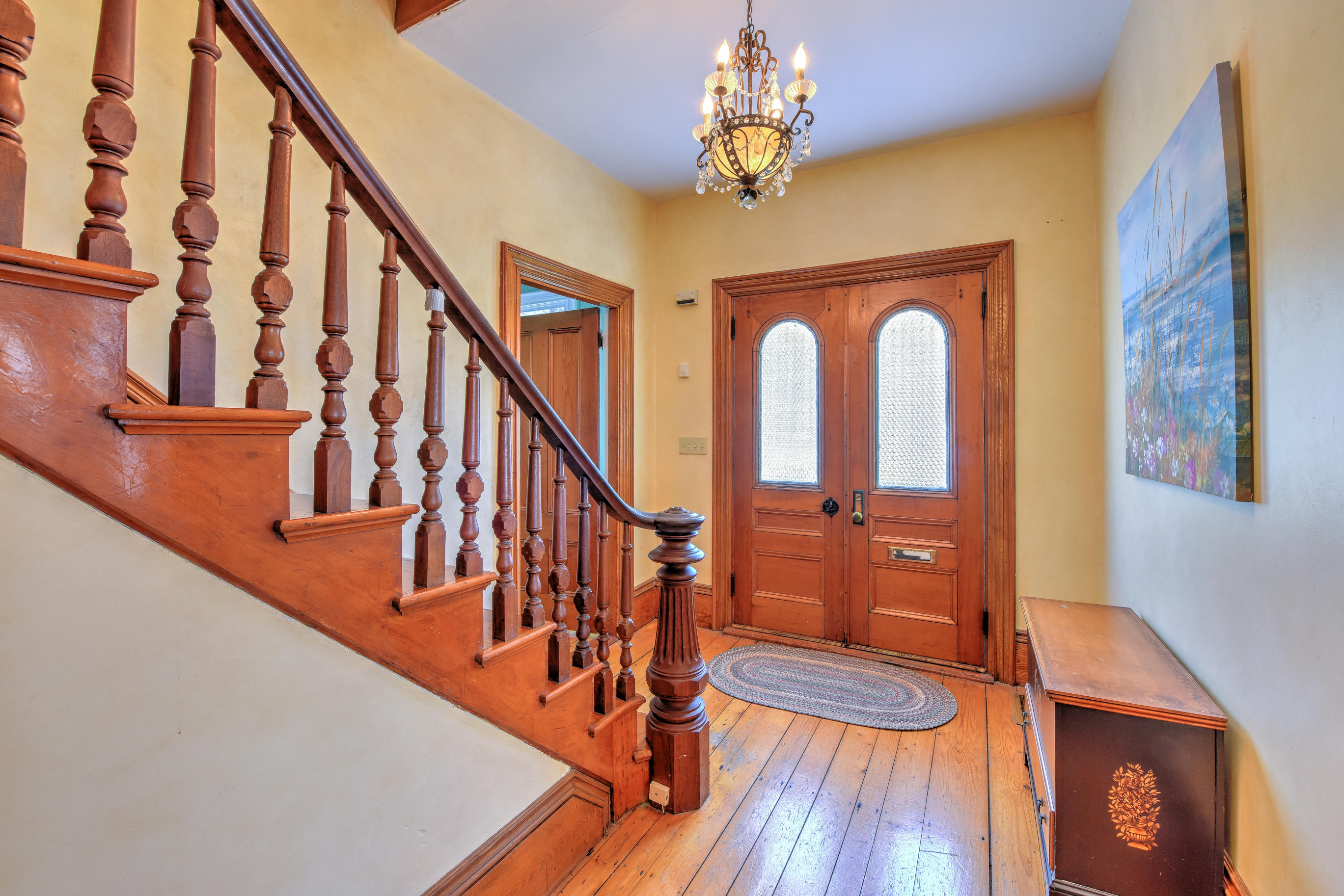 508 Main Street Centerville, MA 02632 - Photo 7 of 35 a view of a livingroom with wooden floor and stairs
