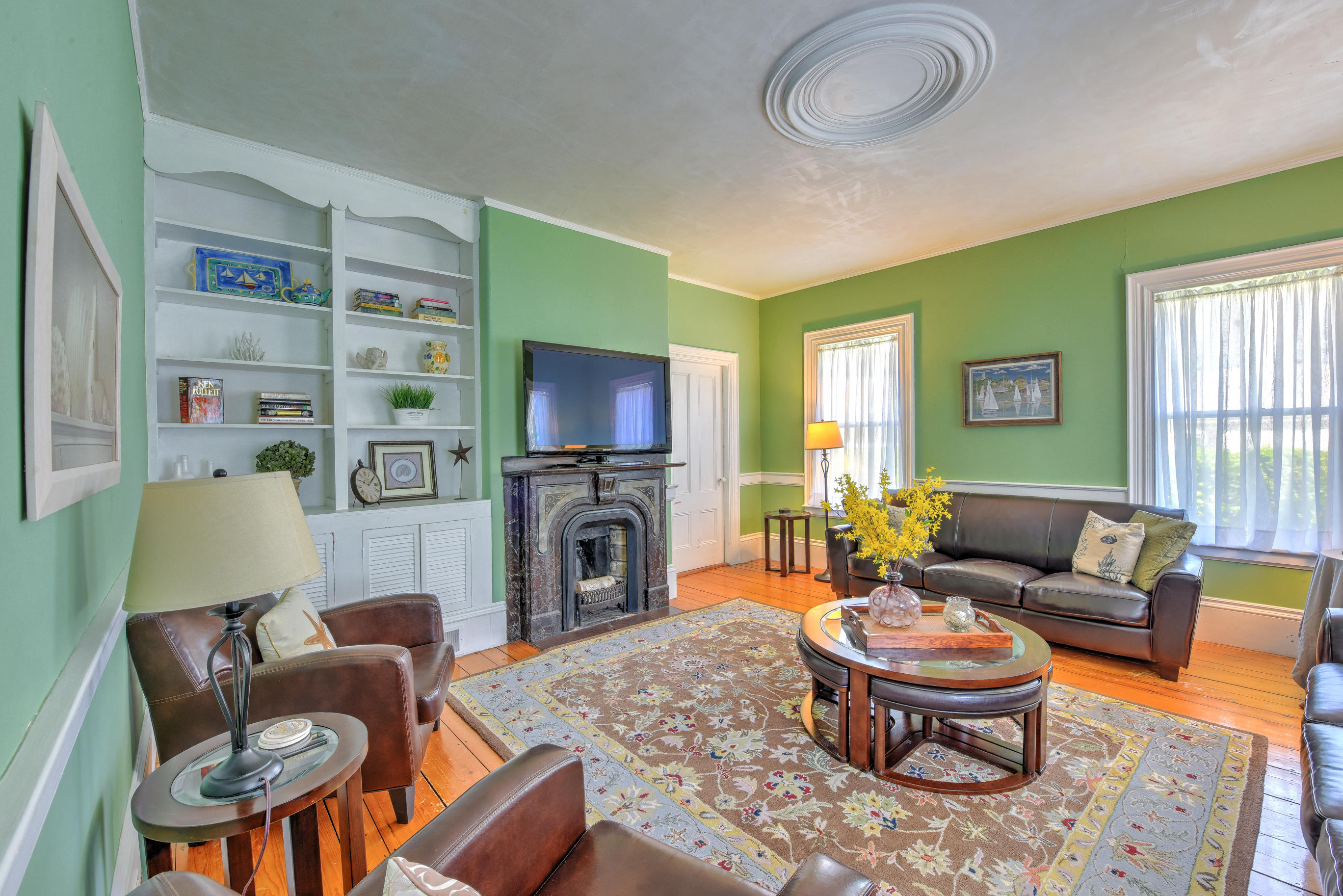 508 Main Street Centerville, MA 02632 - Photo 9 of 35 a living room with furniture fireplace and a window