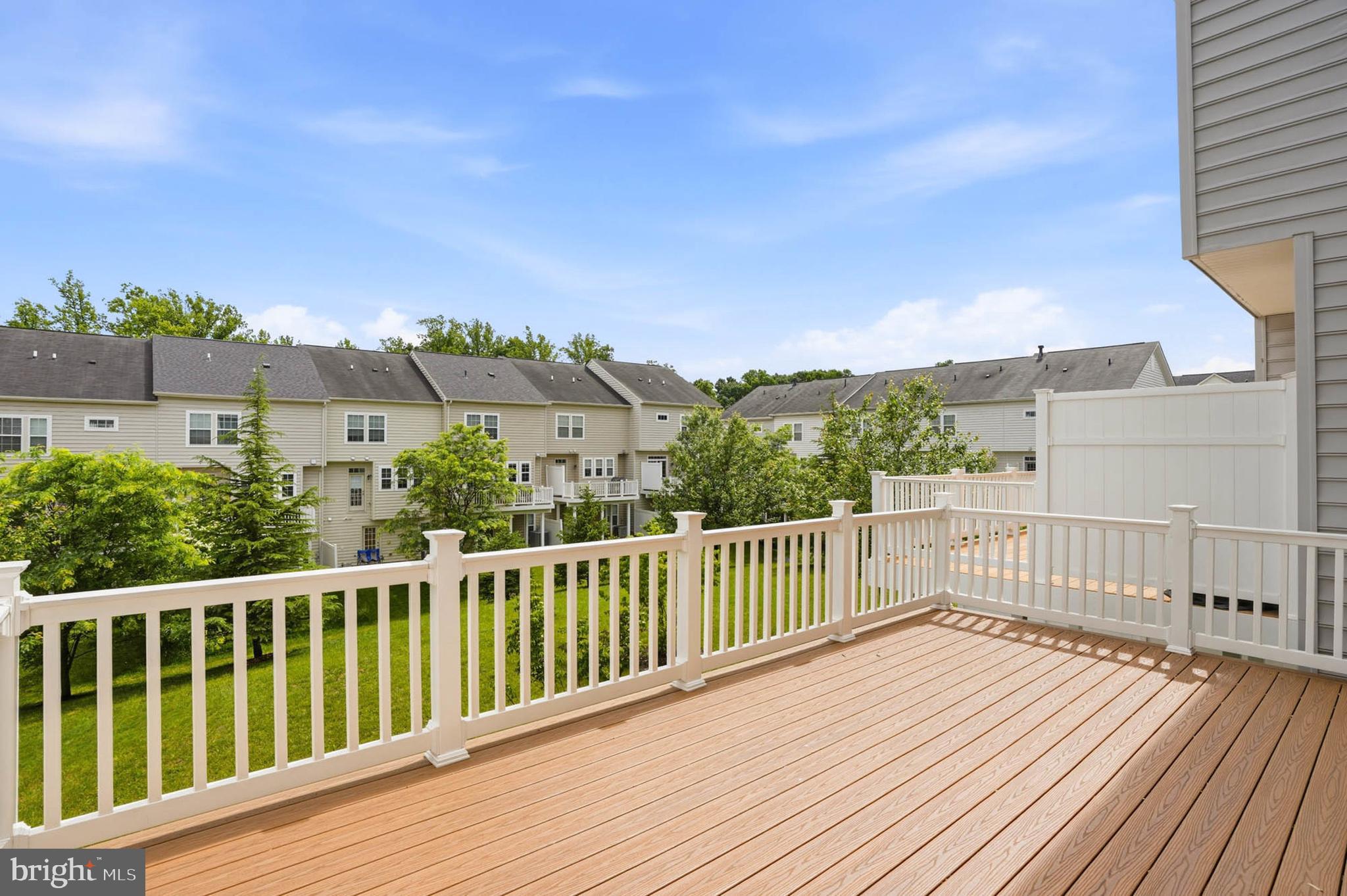 9817 Solar Course Laurel, MD 20723 - Photo 33 of 59 a view of balcony with wooden floor and fence