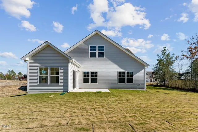 a house with trees in the background