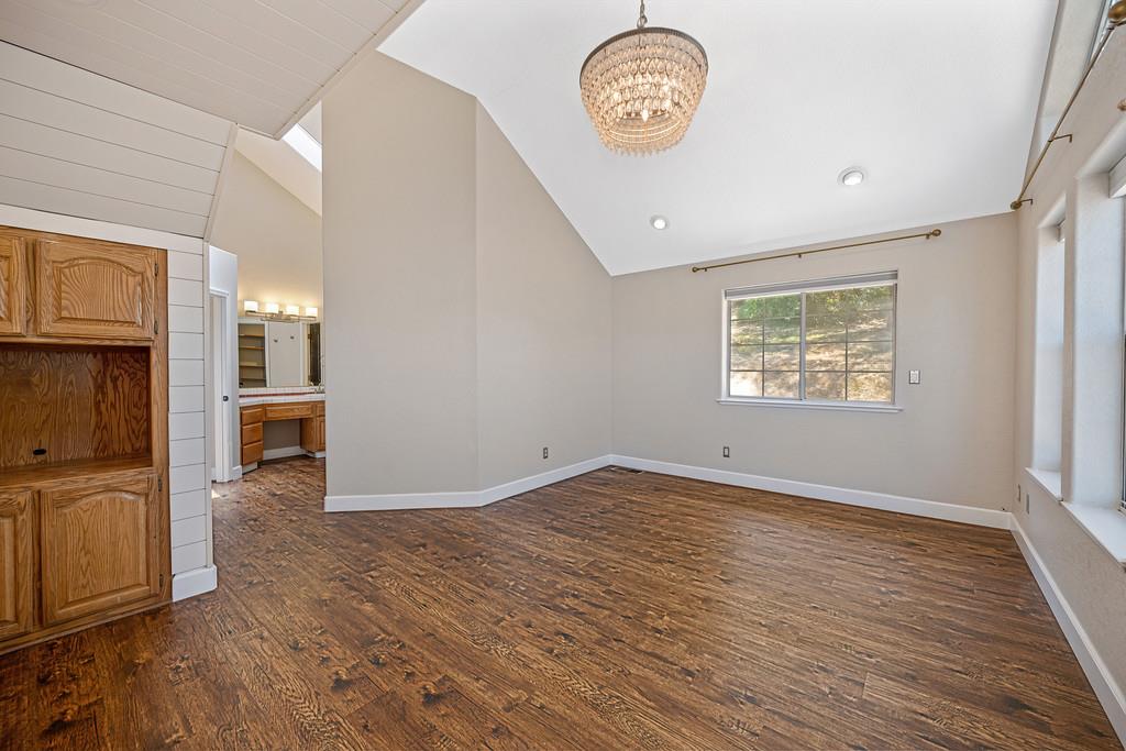 3154 Twin K Road Pilot Hill, CA 95664 - Photo 49 of 89 a view of an empty room with a window and wooden floor
