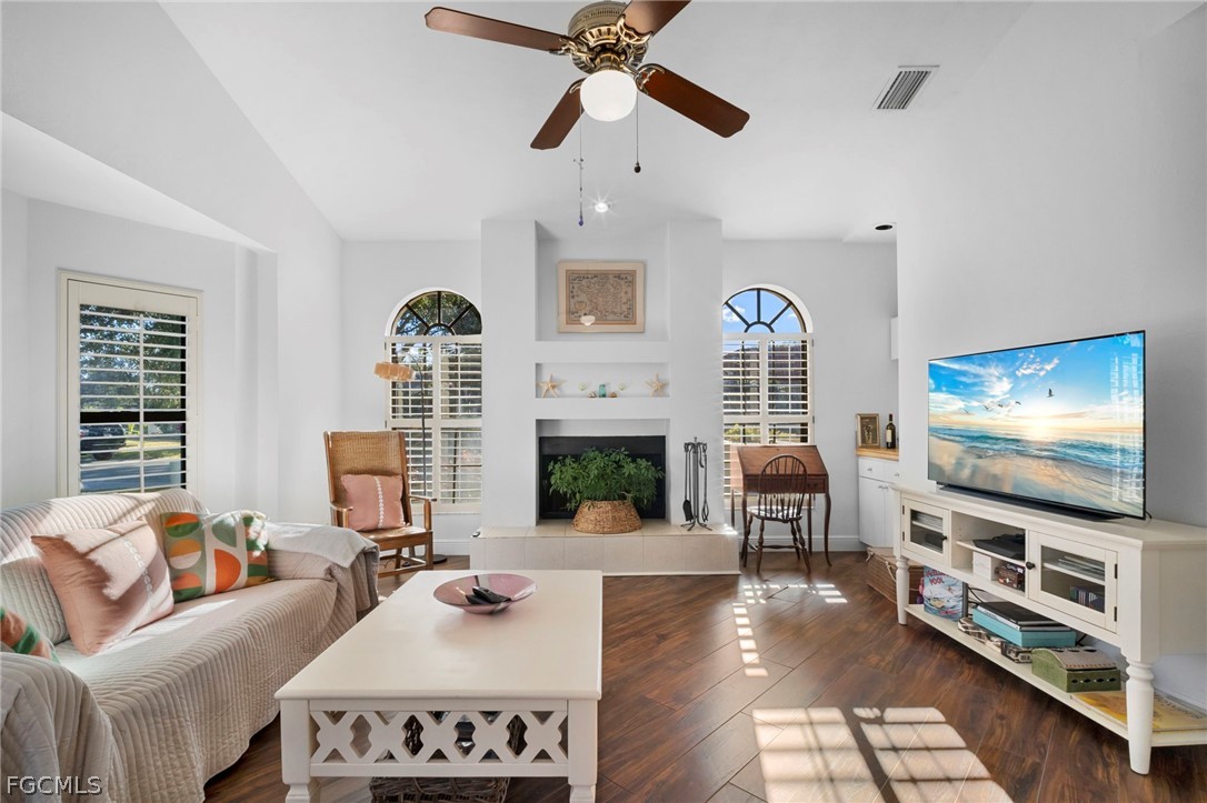 11772 Mahogany Run Fort Myers, FL 33913 - Photo 24 of 50 a living room with furniture fireplace and a flat screen tv