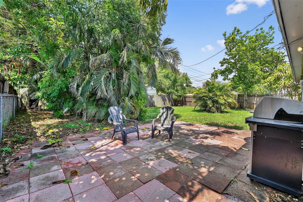 11119 Temple Avenue Seminole, FL 33772 - Photo 23 of 35 a view of a park with plants and a bench