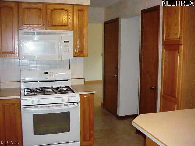 9037 Root Road North Ridgeville, OH 44039 - Photo 8 of 18 All appliances stay. Note pantry cabinet plus original pantry. Pull out drawers and appliance garage.
