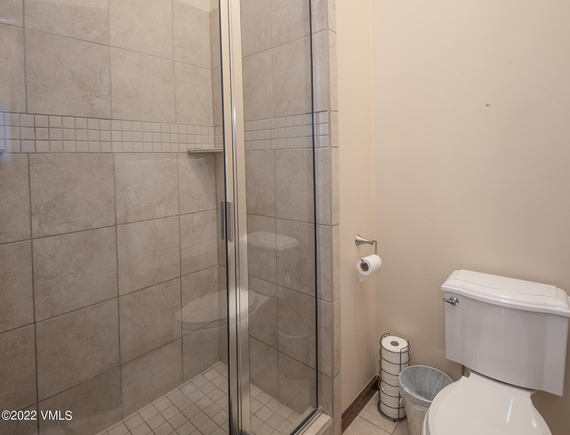 213 Bluffs Drive Eagle, CO 81631 - Photo 14 of 35 a white toilet sitting next to a bathroom sink