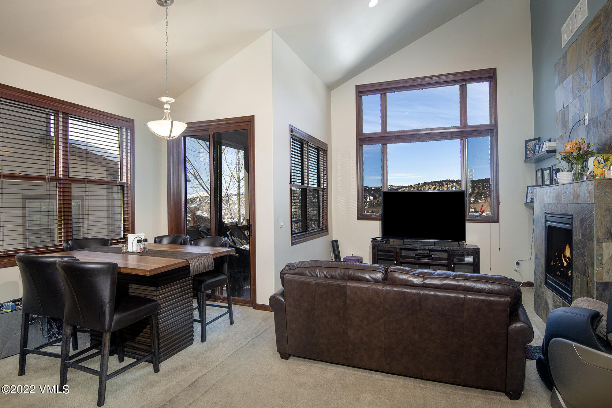 213 Bluffs Drive Eagle, CO 81631 - Photo 2 of 35 a living room with fireplace furniture and a flat screen tv