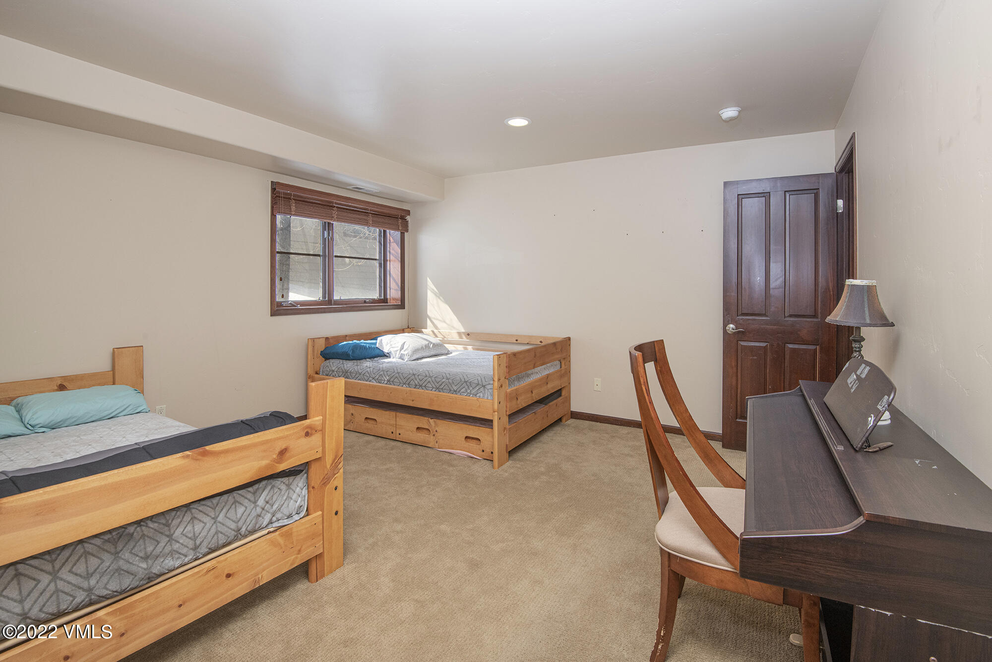 213 Bluffs Drive Eagle, CO 81631 - Photo 21 of 35 a bedroom with furniture and a window
