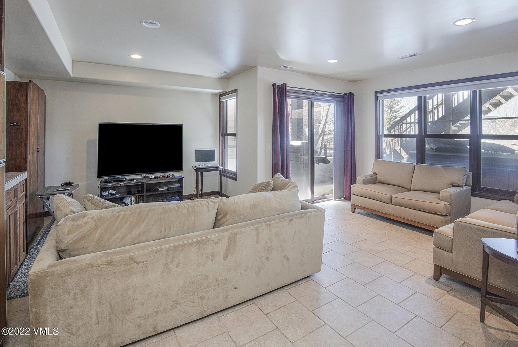 213 Bluffs Drive Eagle, CO 81631 - Photo 23 of 35 a living room with furniture and a flat screen tv