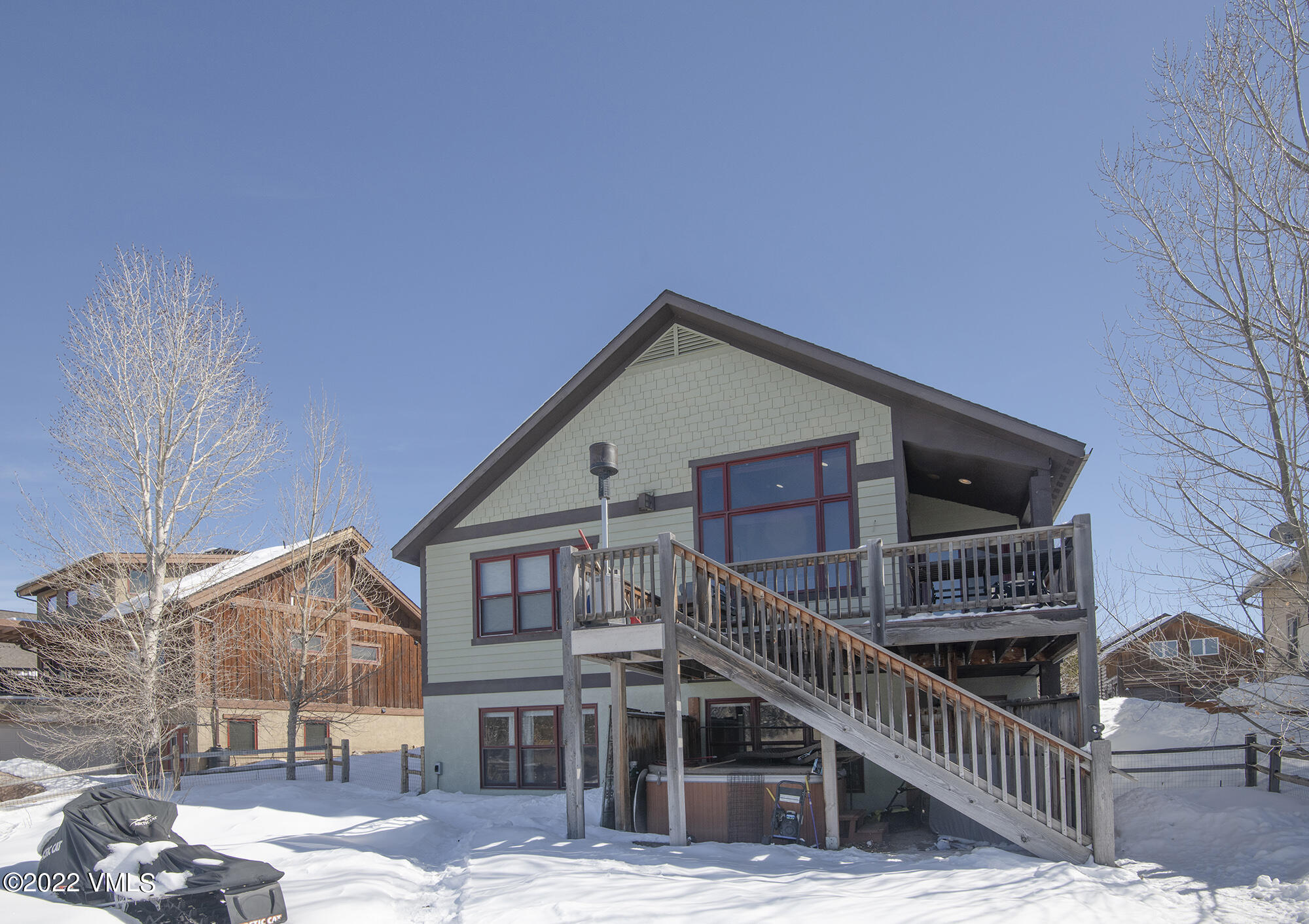 213 Bluffs Drive Eagle, CO 81631 - Photo 34 of 35 a view of a house with a small yard and wooden fence
