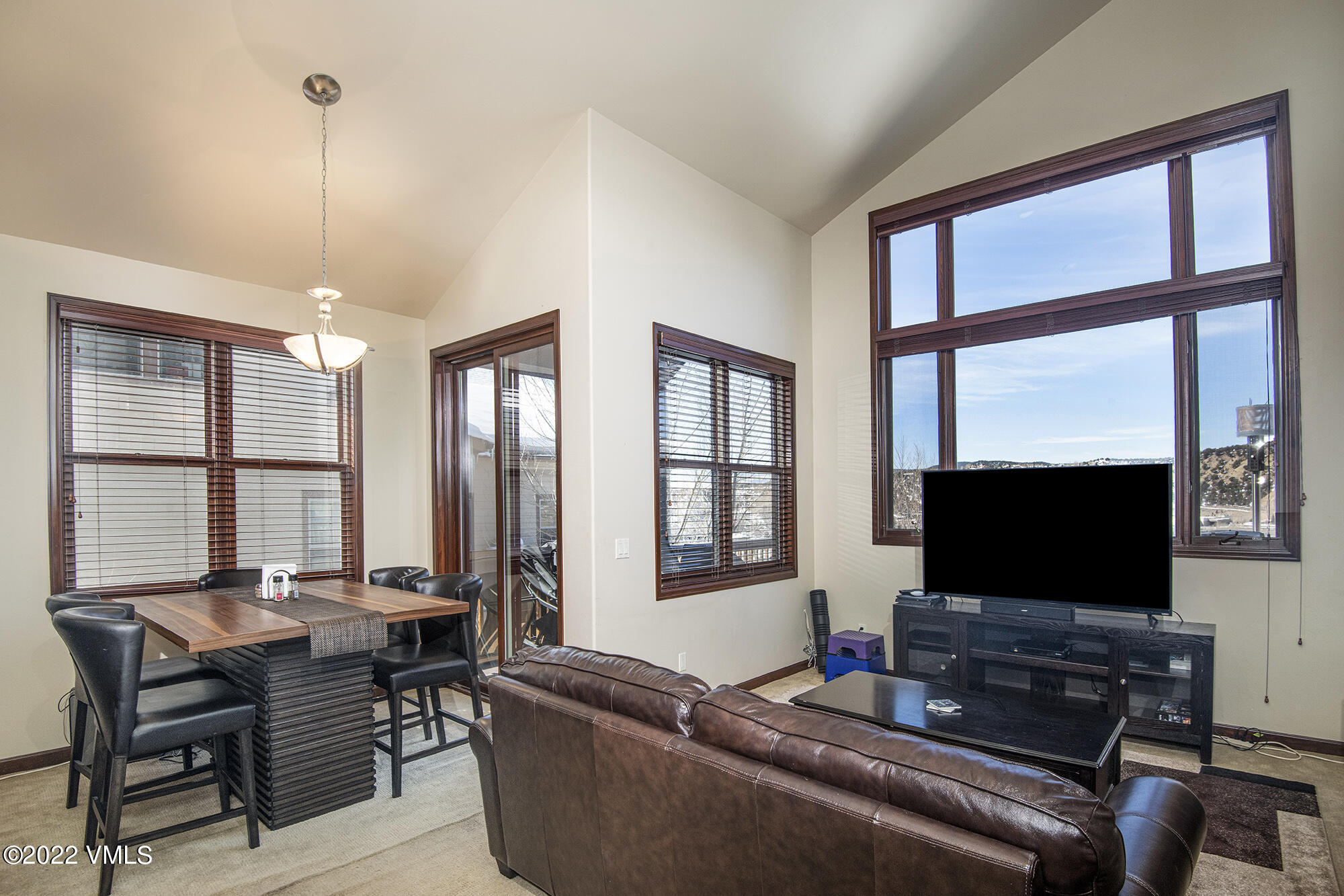 213 Bluffs Drive Eagle, CO 81631 - Photo 4 of 35 a living room with furniture and a flat screen tv