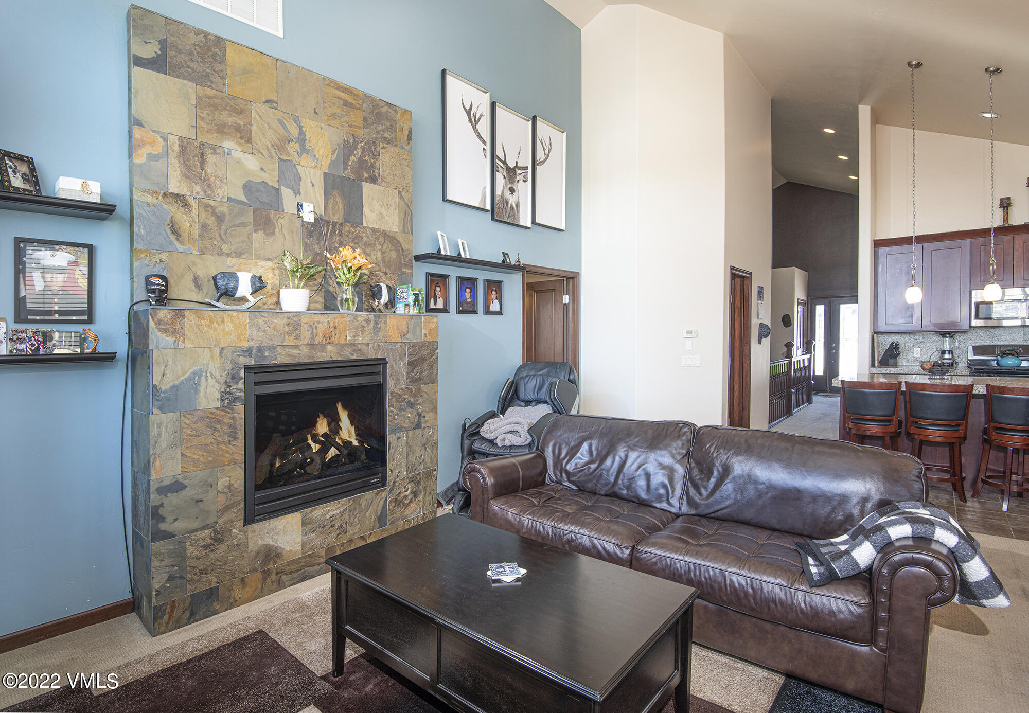 213 Bluffs Drive Eagle, CO 81631 - Photo 5 of 35 a living room with furniture and a fireplace