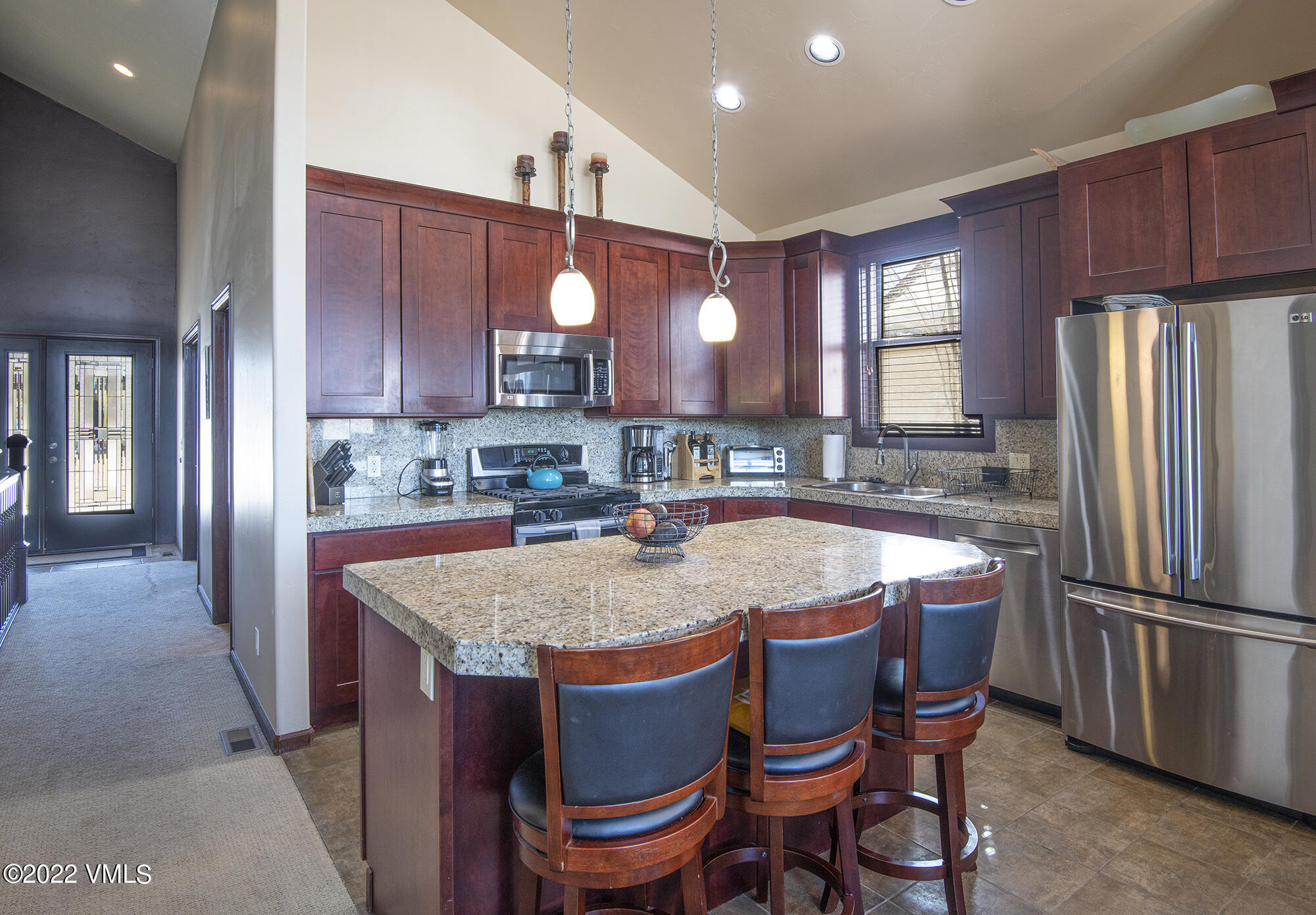 213 Bluffs Drive Eagle, CO 81631 - Photo 8 of 35 a dining table with chairs and window