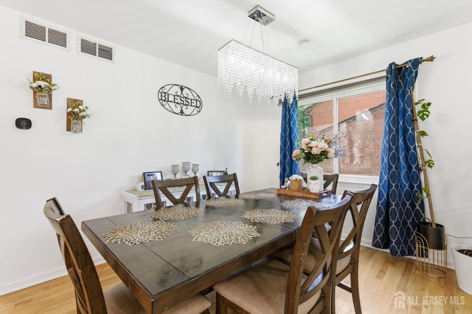 213 Normandy Road Edison, NJ 08820 - Photo 19 of 45 a view of a dining room with furniture and wooden floor