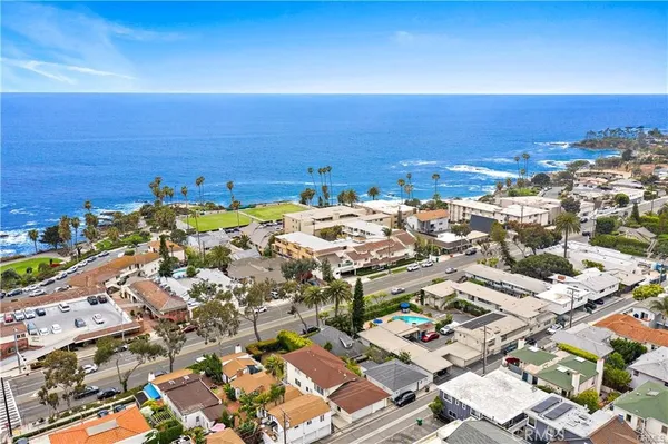an aerial view of a ocean and city