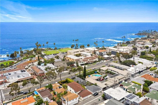 an aerial view of a ocean and city