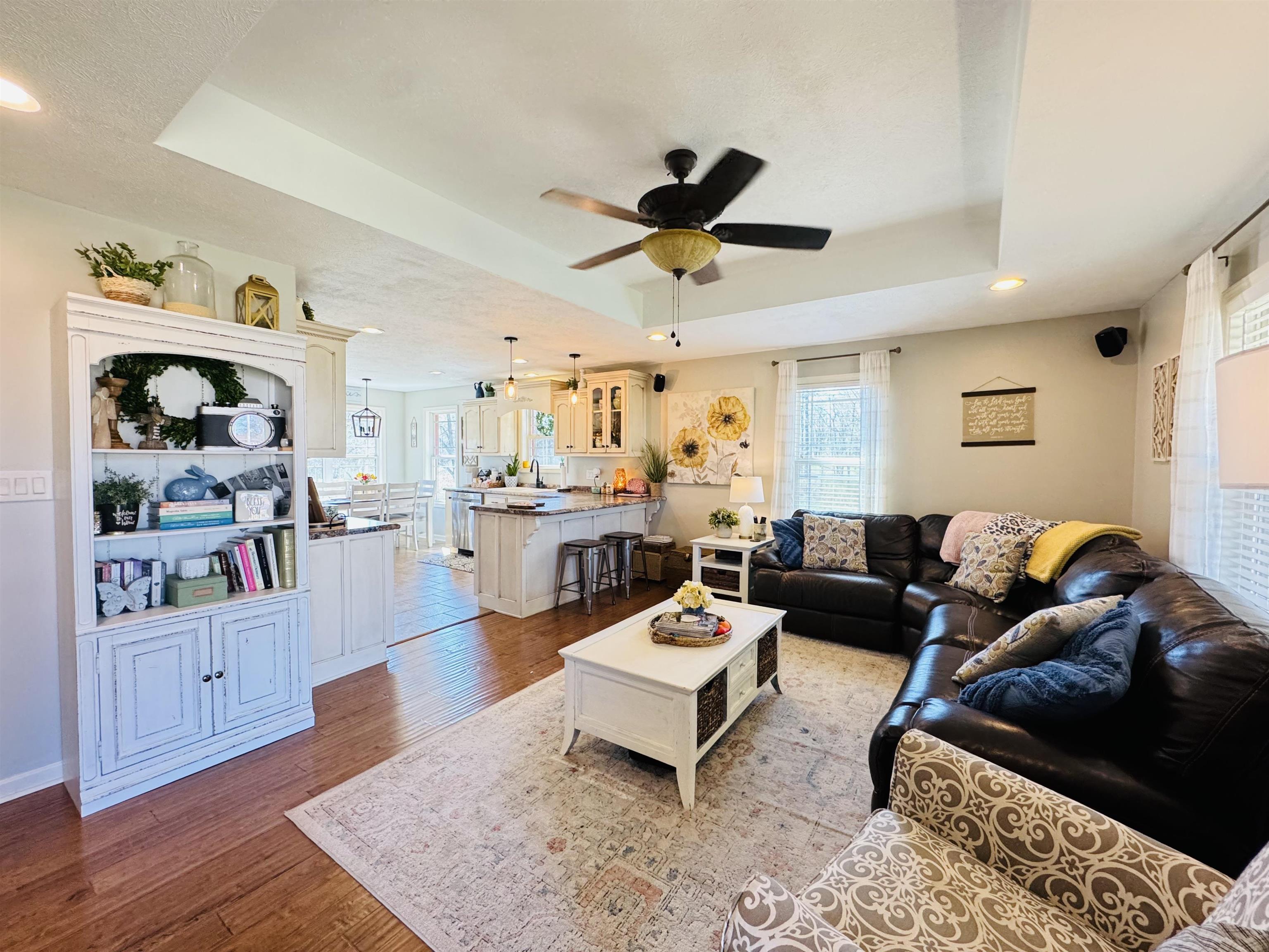 40 Foxtrot Road Adamsville, TN 38310 - Photo 13 of 39 Living room with recessed lighting, baseboards, a raised ceiling, ceiling fan, and wood finished floors