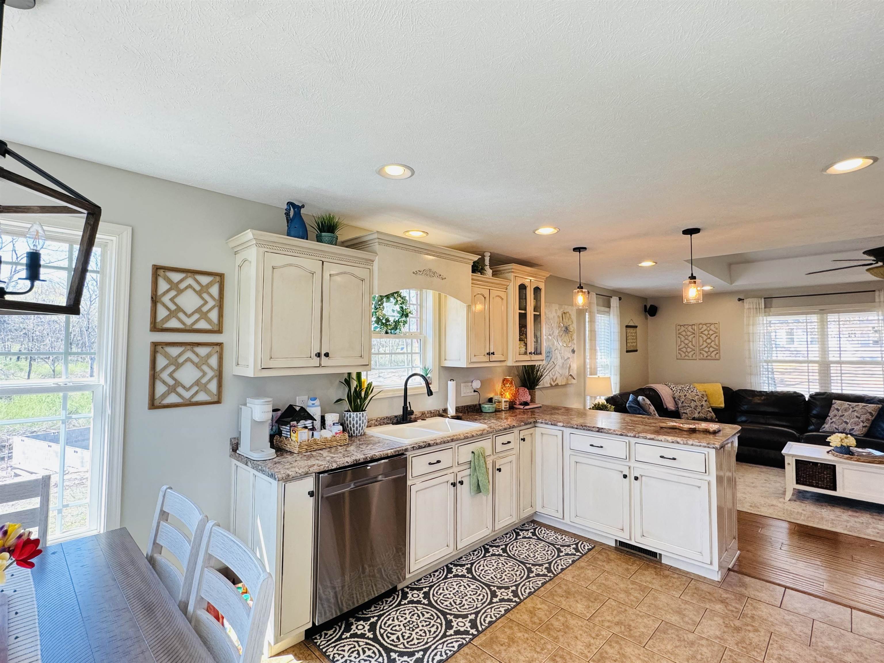 40 Foxtrot Road Adamsville, TN 38310 - Photo 37 of 39 Kitchen with open floor plan, plenty of natural light, a sink, dishwasher, and a peninsula