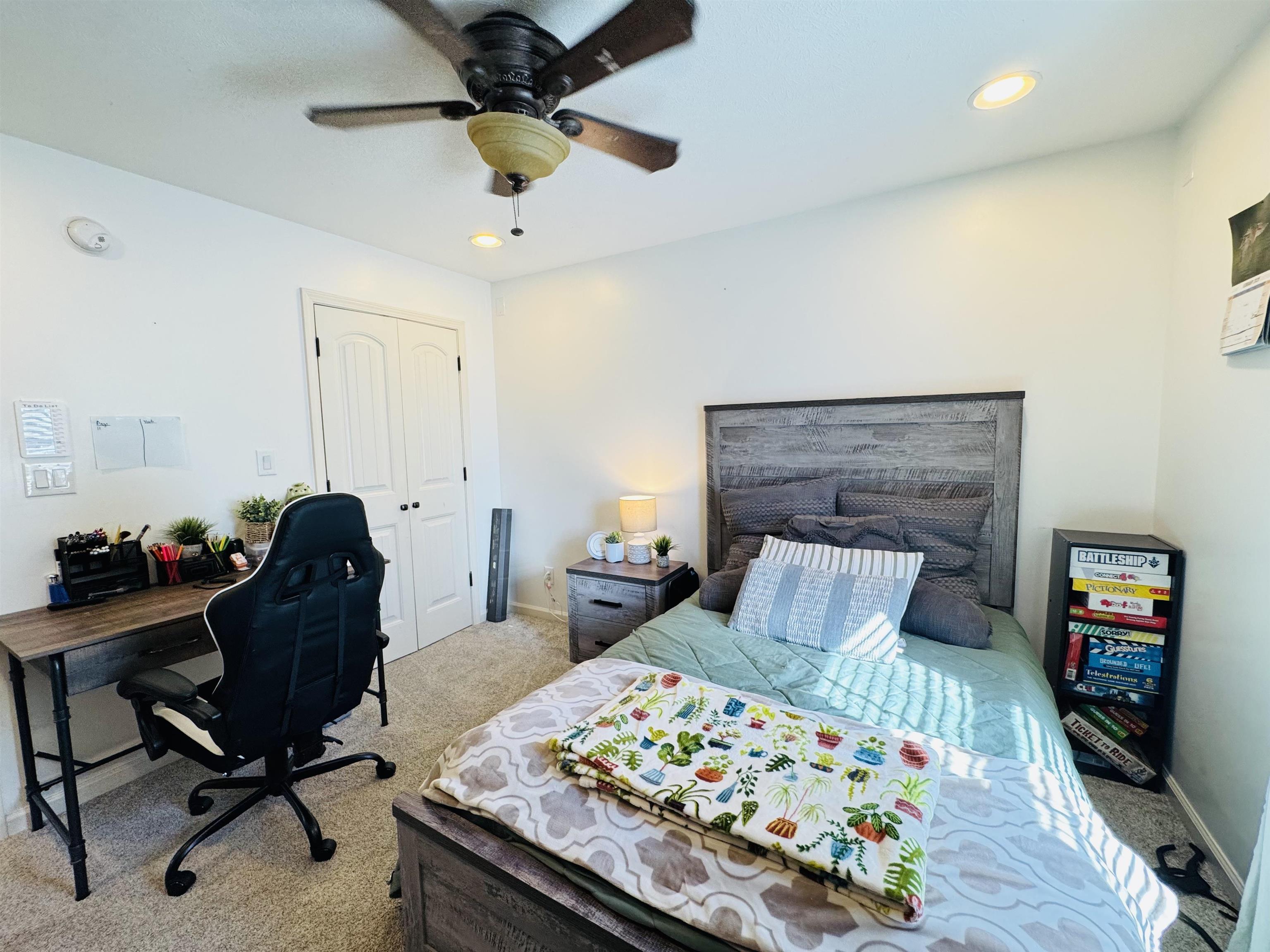 40 Foxtrot Road Adamsville, TN 38310 - Photo 24 of 39 Bedroom with baseboards, a closet, light colored carpet, and ceiling fan