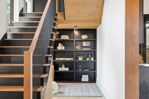 a living room with furniture a fireplace and decor