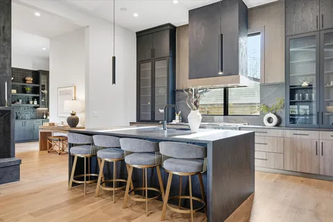 a spacious bathroom with a double vanity sink and a large mirror
