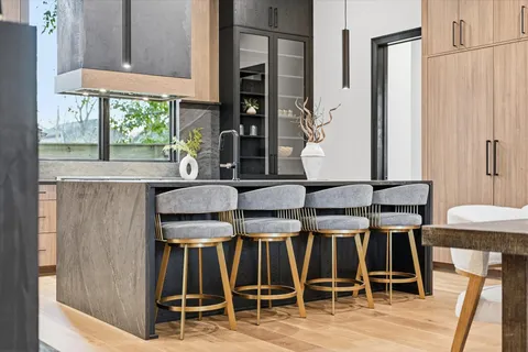 a spacious bedroom with a large bed and a large window