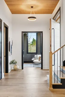 a living room with furniture and a potted plant