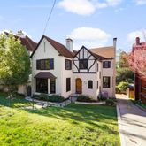 a front view of a house with a yard table and chairs