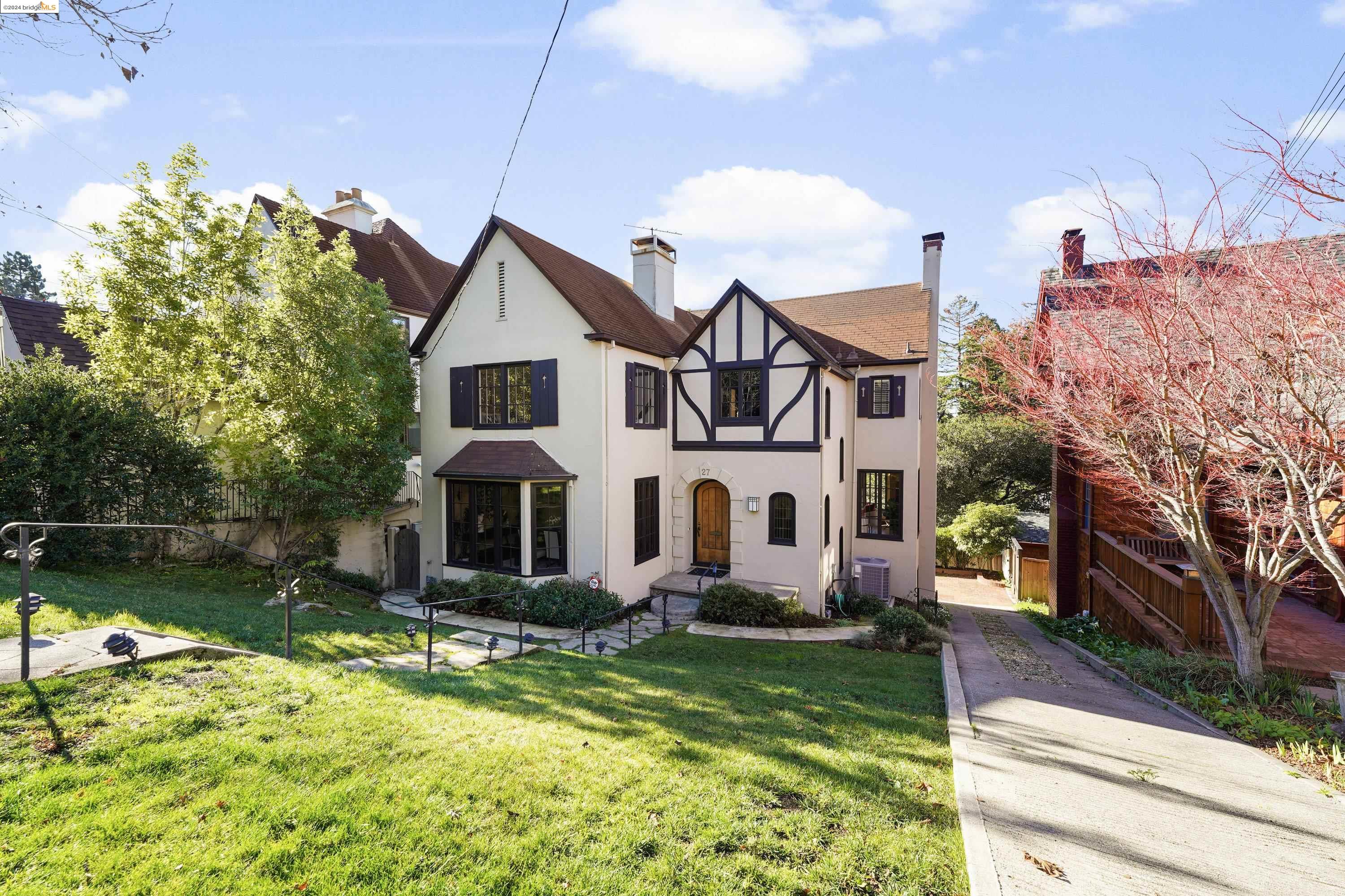 a front view of a house with a yard table and chairs