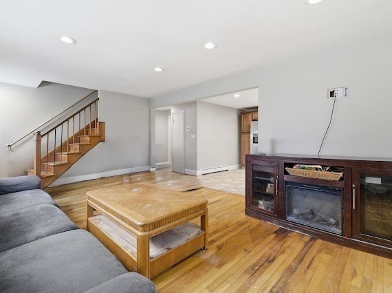 65 Gore Road Revere, MA 02151 - Photo 20 of 35 a living room with furniture pool table and a fireplace