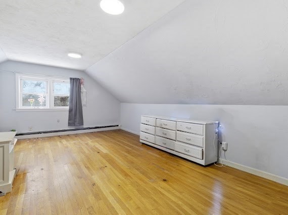65 Gore Road Revere, MA 02151 - Photo 23 of 35 a view of an empty room with wooden floor and a window