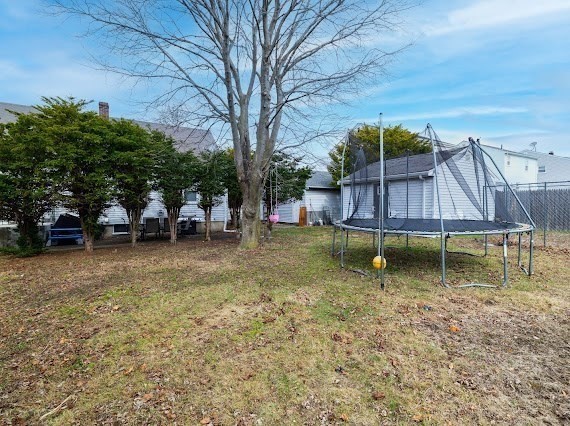 65 Gore Road Revere, MA 02151 - Photo 9 of 35 a backyard of a house with table and chairs