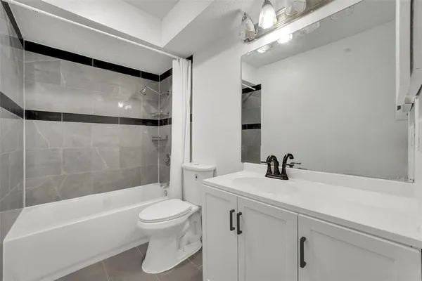 a bathroom with a sink a toilet and a bathtub