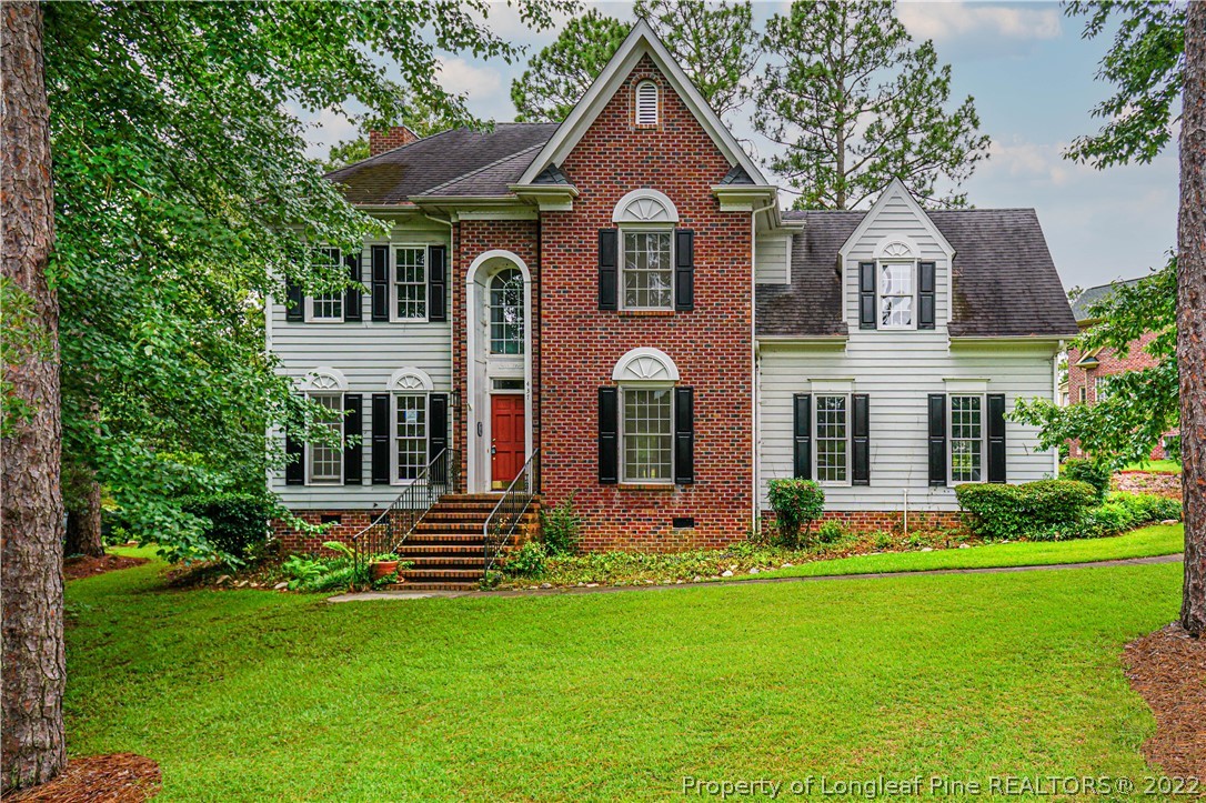 437 Shawcroft Road Fayetteville, NC 28311 - Photo 1 of 34 a front view of a house with a yard