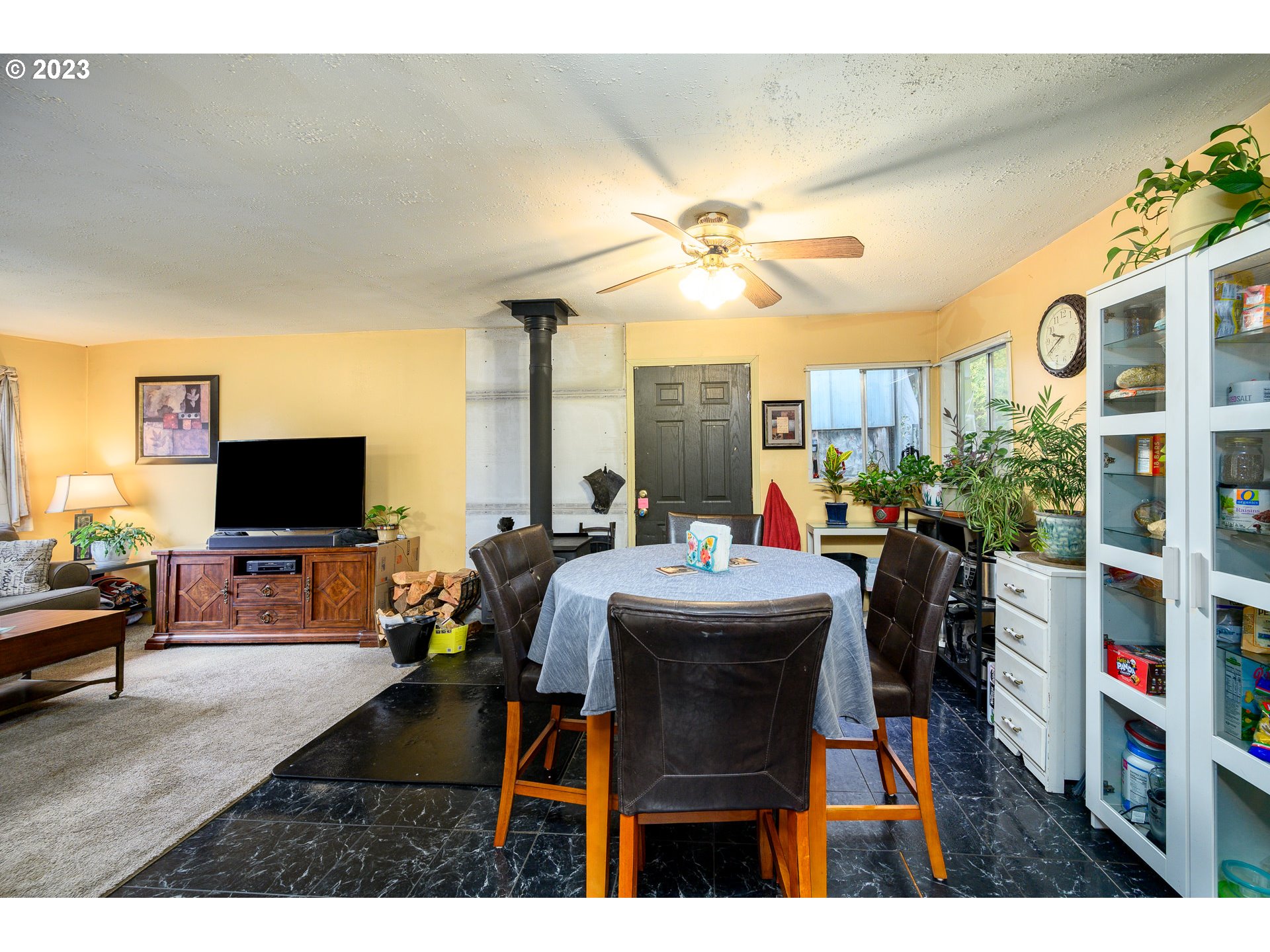 7260 Ash Street Grand Ronde, OR 97347 - Photo 20 of 39 a living room with furniture a flat screen tv and a large window