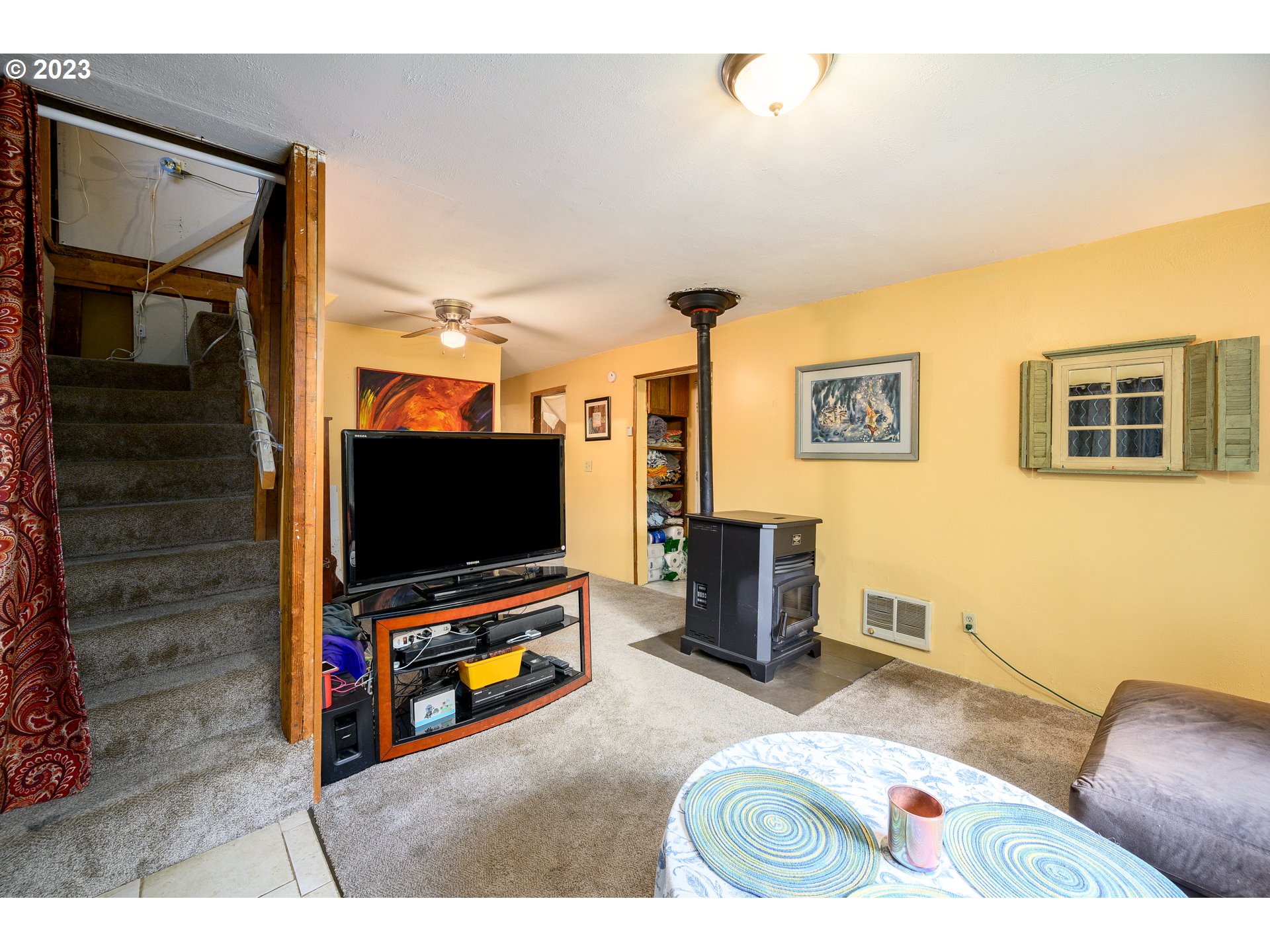 7260 Ash Street Grand Ronde, OR 97347 - Photo 30 of 39 a living room with furniture and a flat screen tv