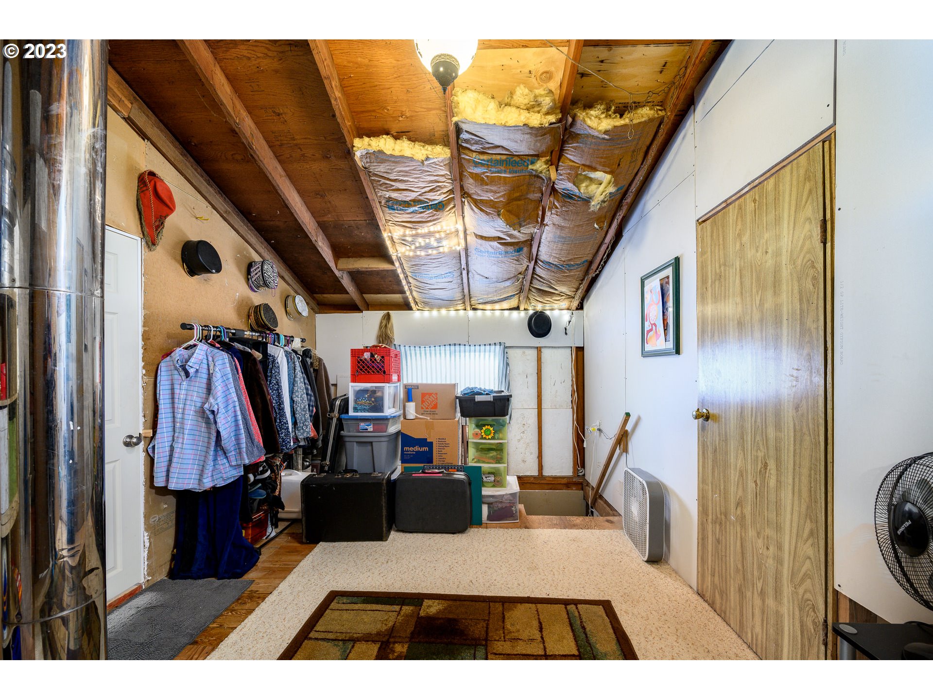 7260 Ash Street Grand Ronde, OR 97347 - Photo 31 of 39 a view of walk in closet with clothes and shoes