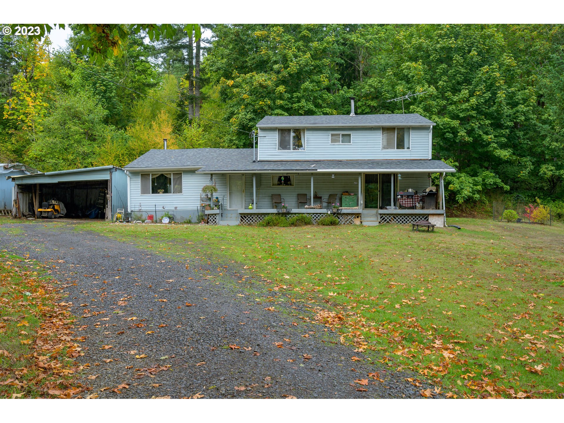 7260 Ash Street Grand Ronde, OR 97347 - Photo 10 of 39 a view of house with yard outdoor seating and green space
